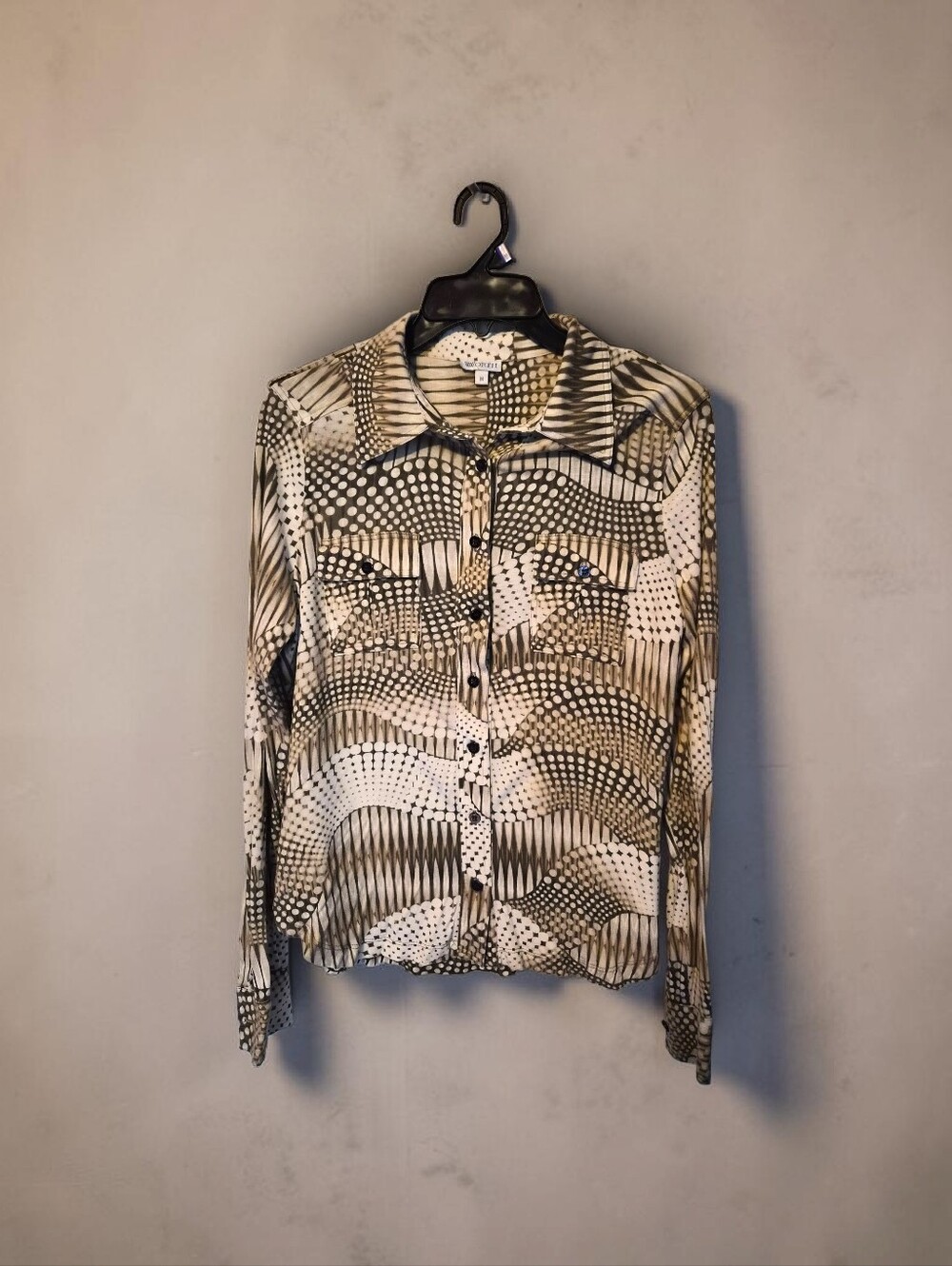 Worth New York. It is a long-sleeve, button-down blouse